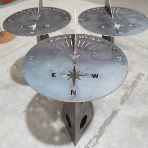Metal Compass Sundials Multiple on stand in Garden Setting