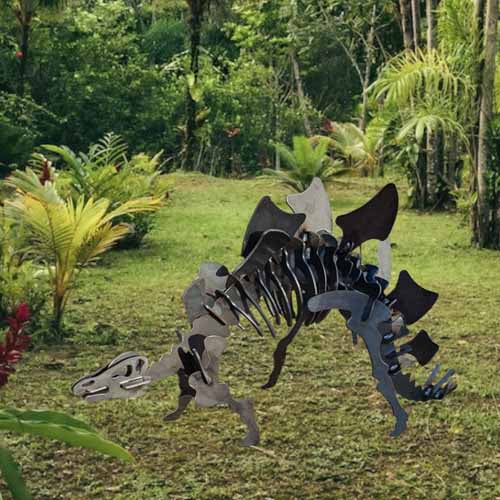 Stegosaurus Dinosaur Sculpture Metal Small in Bush Setting